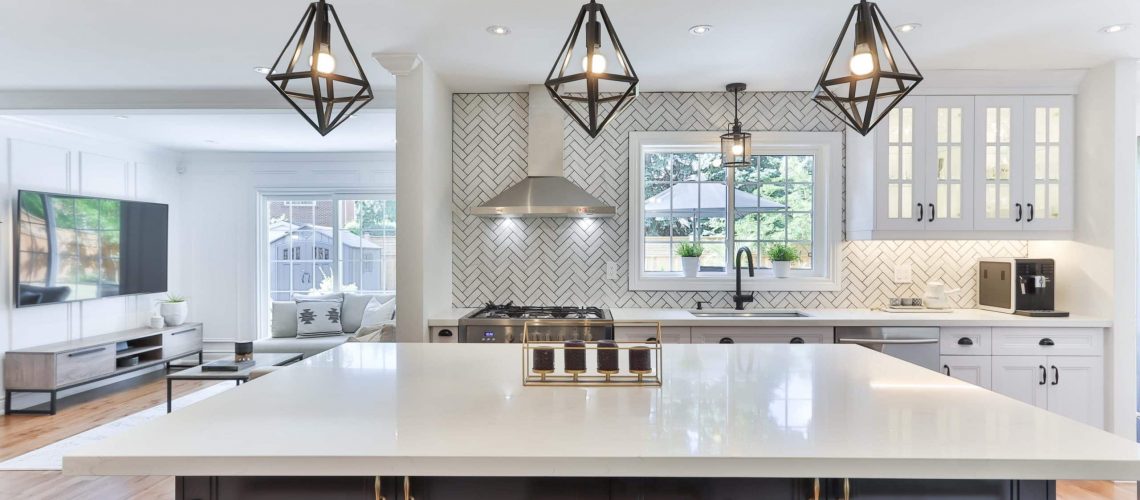An image of a modern kitchen with unique lighting accents and tasteful staging, primed to sell in Oakland or East Bay.